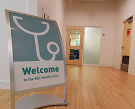 health clinic logo on a welcome sign